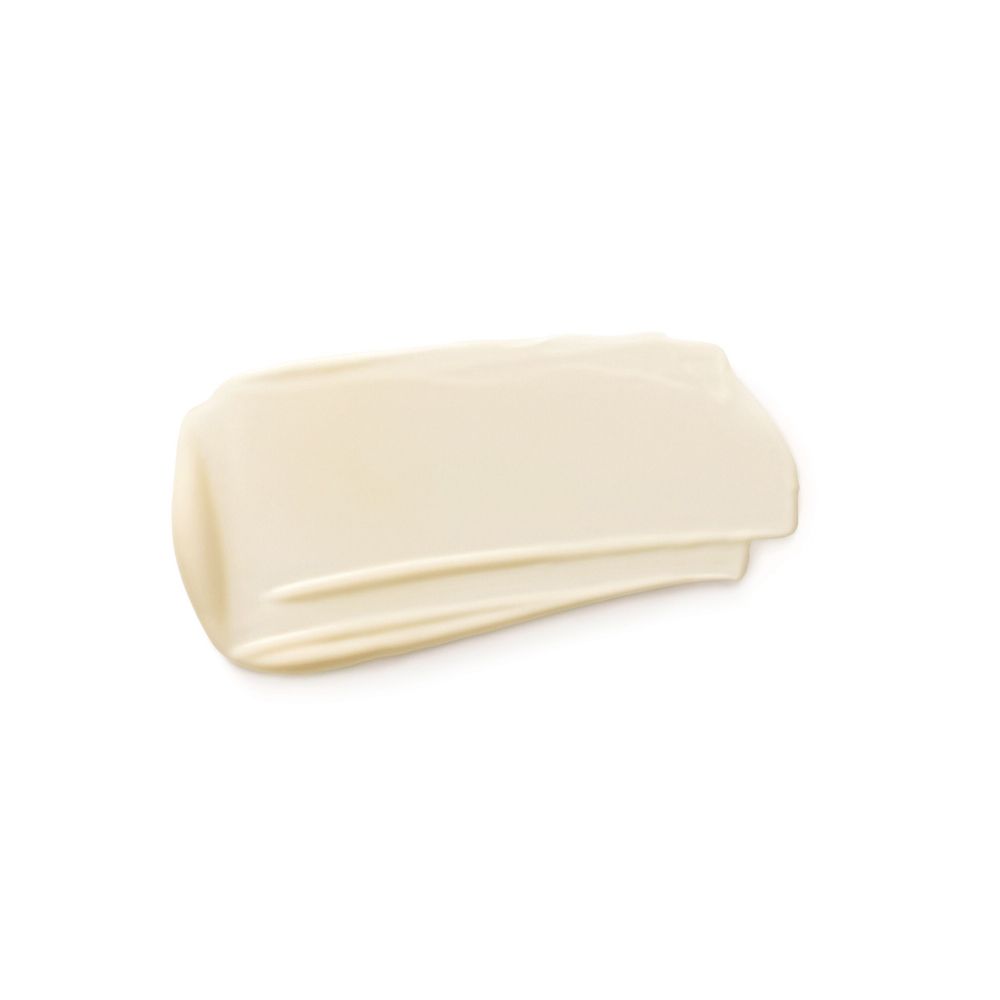 Striscio di crema su sfondo bianco. Texture chiara, color crema.