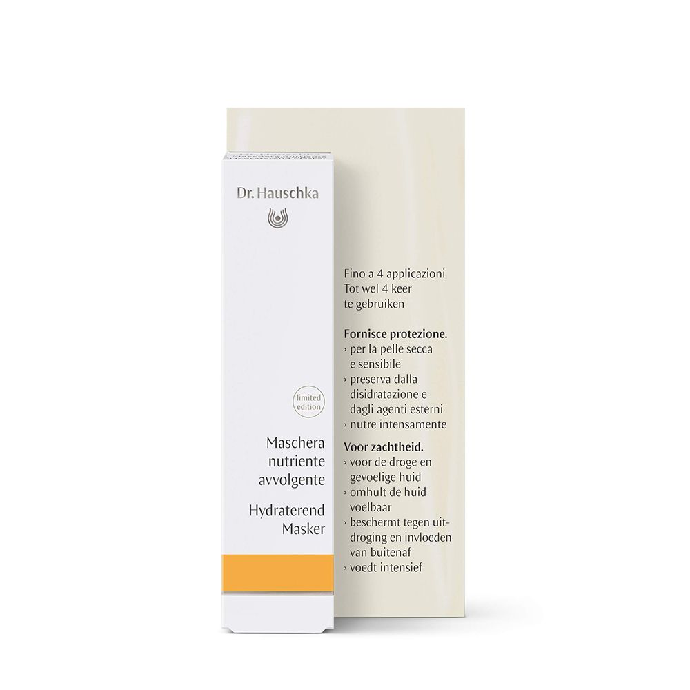 Scatola e tubo. Scritta: Dr. Hauschka, « Maschera Nutriente Avvolgente ». Striscia gialla.
