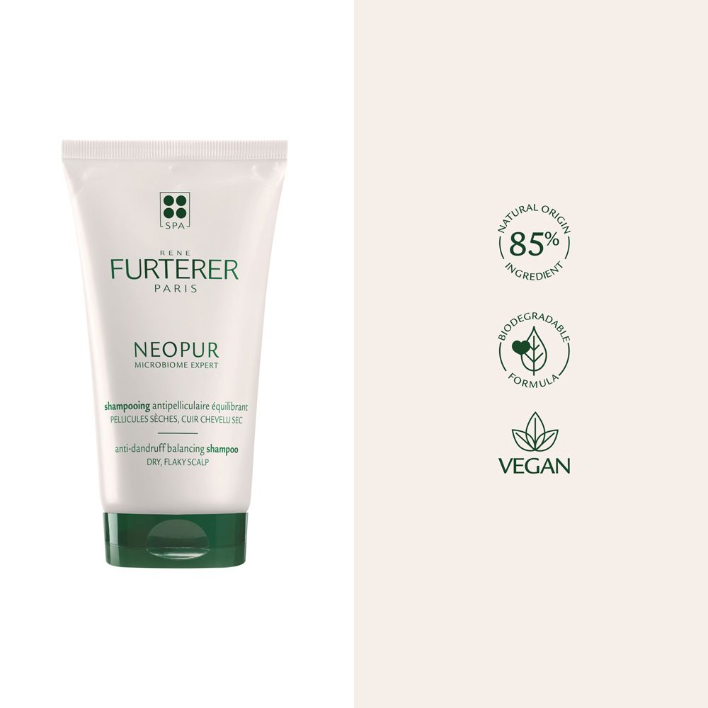 Tubo di shampoo bianco con tappo verde. Testo: René Furterer, Neopur, shampoo antiforfora. Loghi: 85%, biodegradabile, vegano.