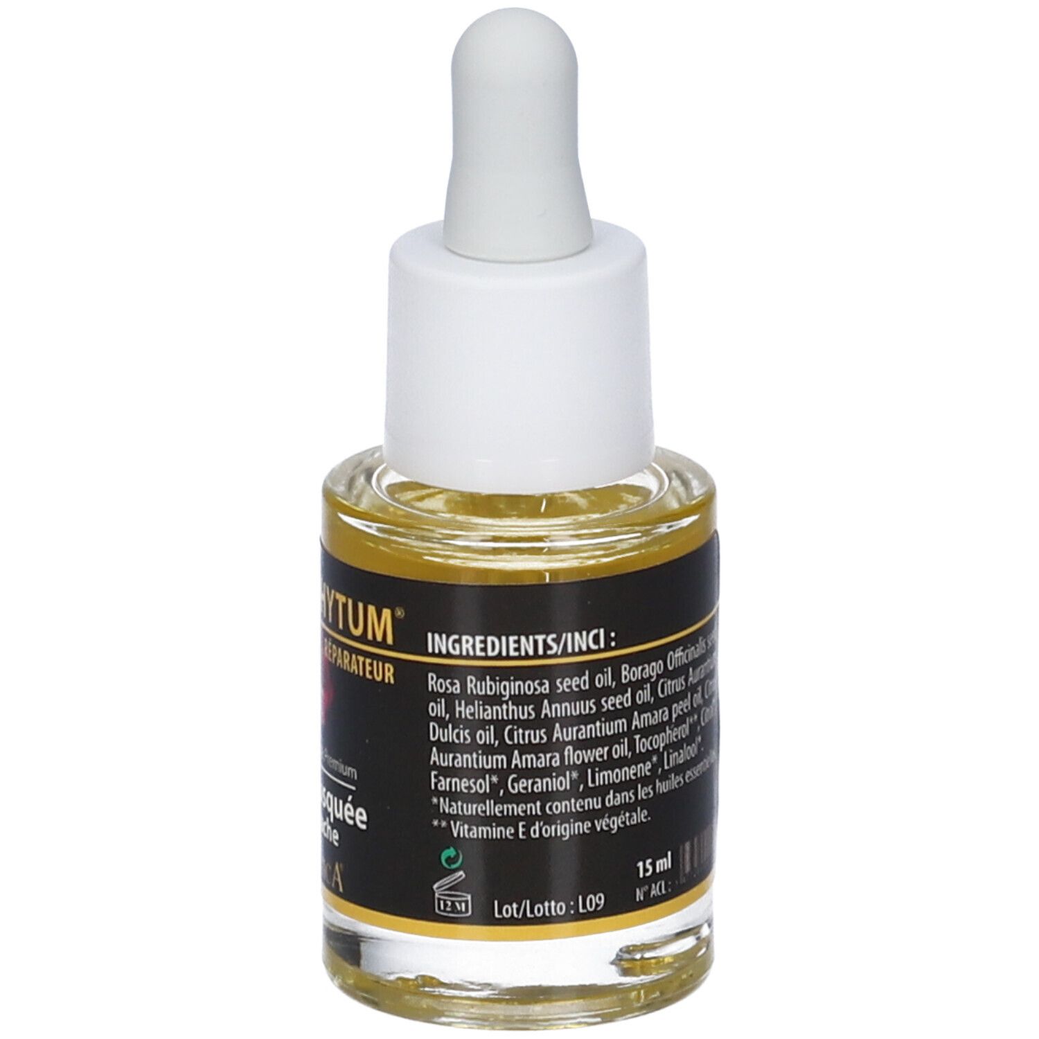 Flacone di vetro con contagocce, riempito con liquido giallastro. Etichetta con ingredienti. Tappo bianco.