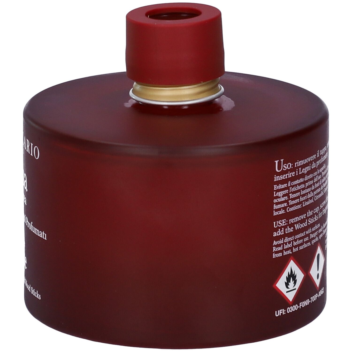 Flacone bordeaux con tappo rosso. Testo: istruzioni per l'uso, avvertenze, simboli di pericolo.