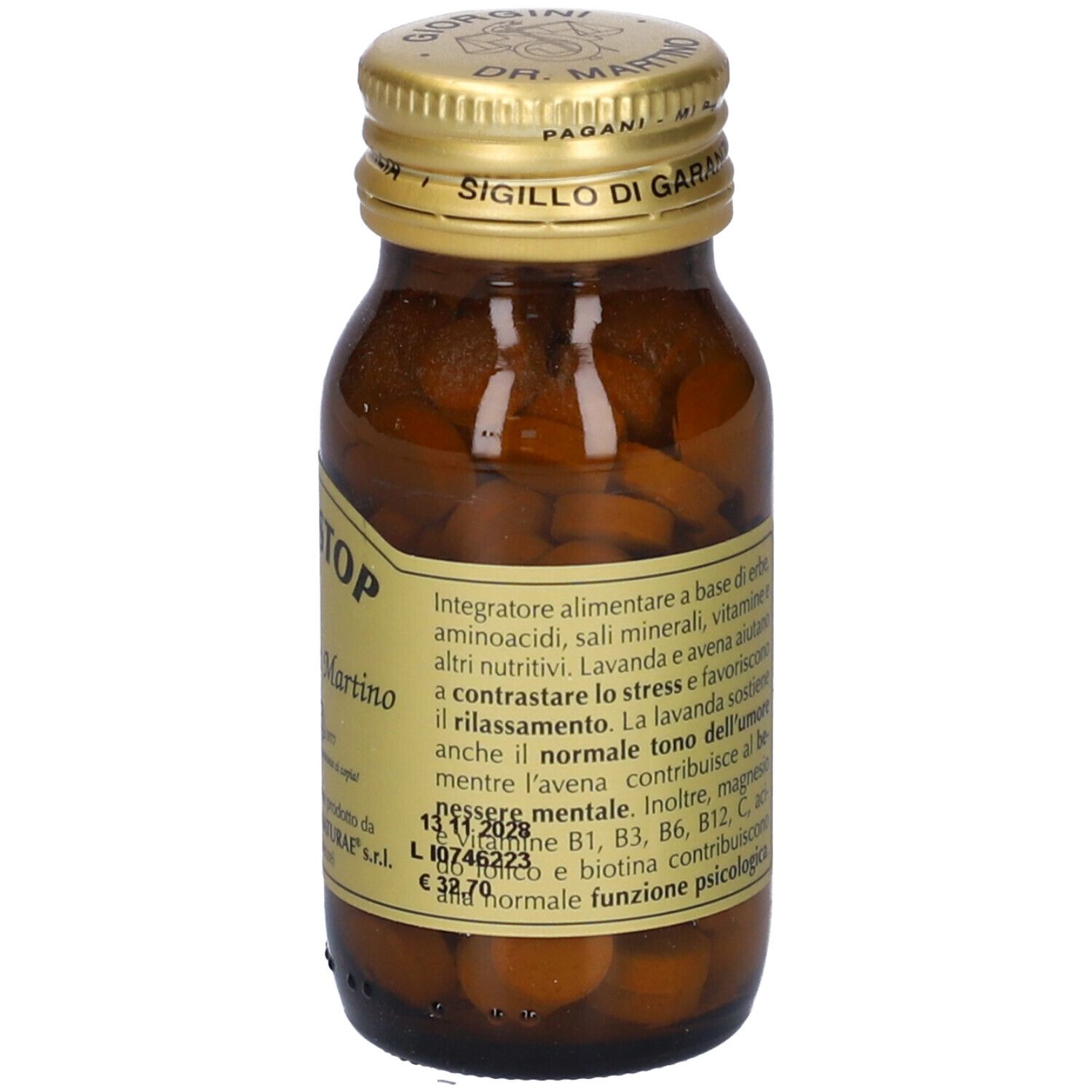 Flacone di vetro marrone con tappo dorato. Etichetta con nome STRESSTOP e altre informazioni.