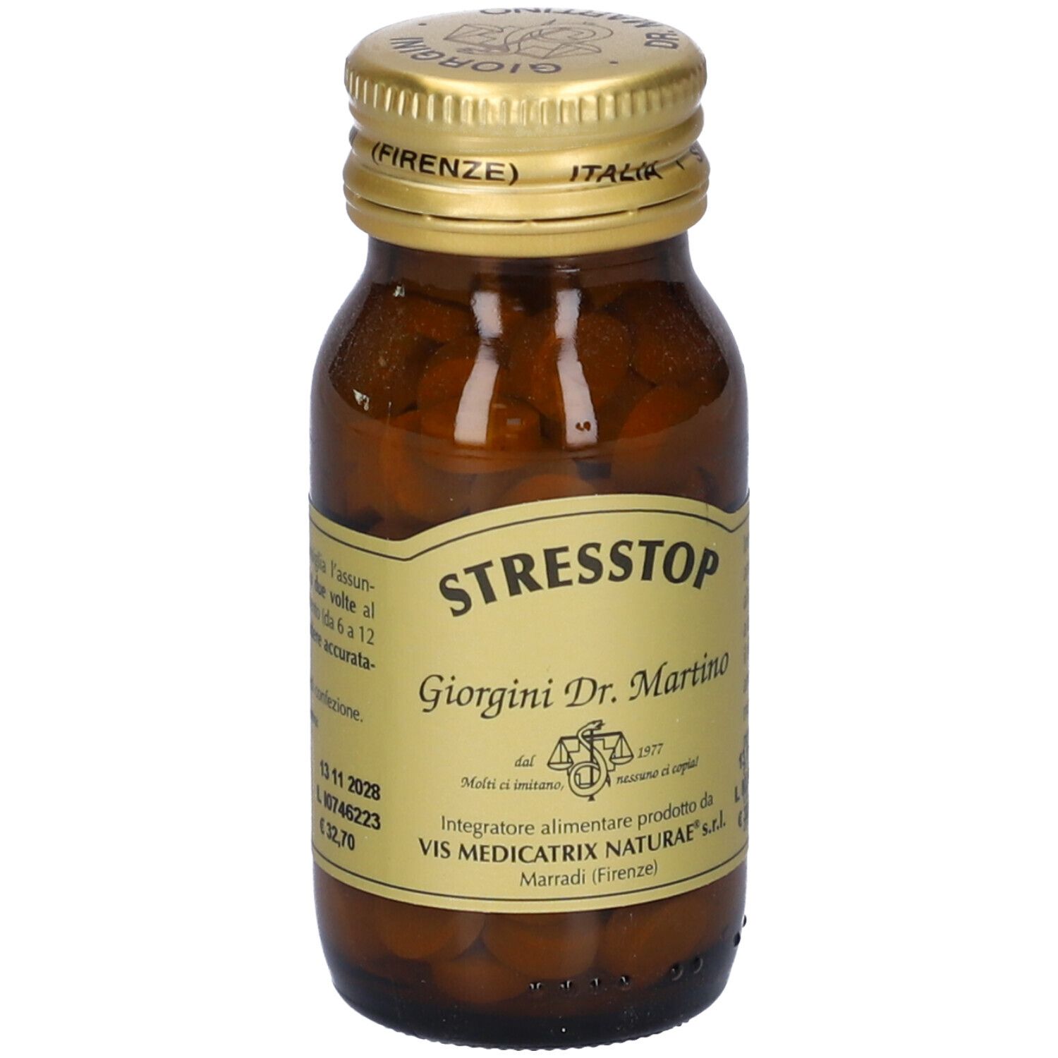 Flacone di vetro marrone con tappo dorato. Etichetta con nome STRESSTOP e altre informazioni.