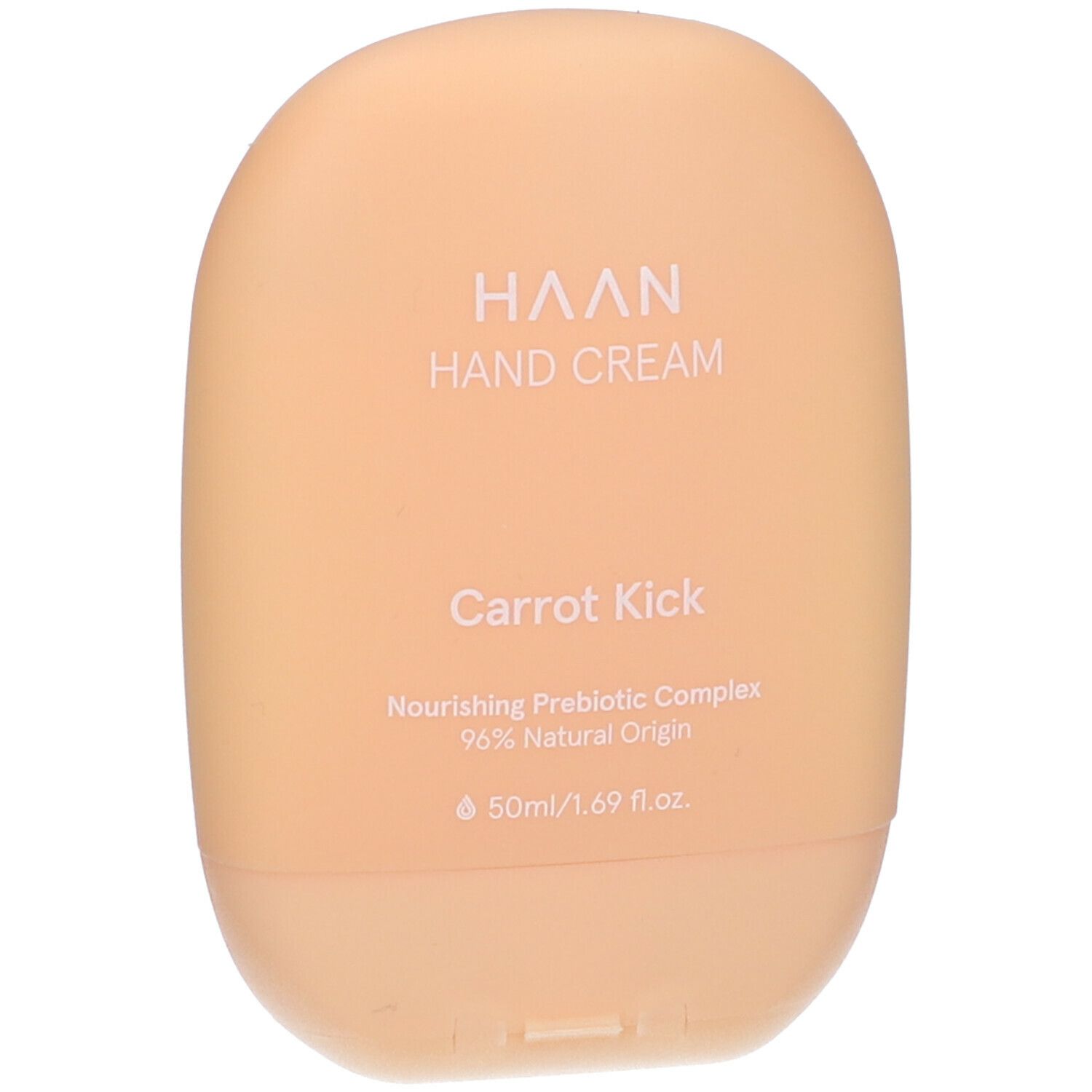 Tubo di crema mani beige. Scritta: HAAN, Hand Cream, Carrot Kick. Contiene il 96% di ingredienti naturali.