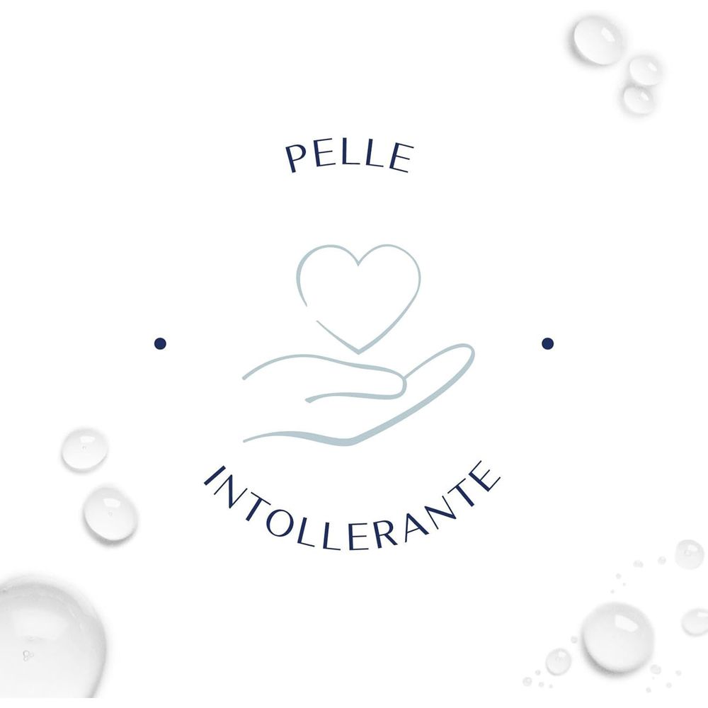 Mano che tiene un cuore. Testo: Pelle Intollerante (pelle intollerante). Gocce d'acqua.