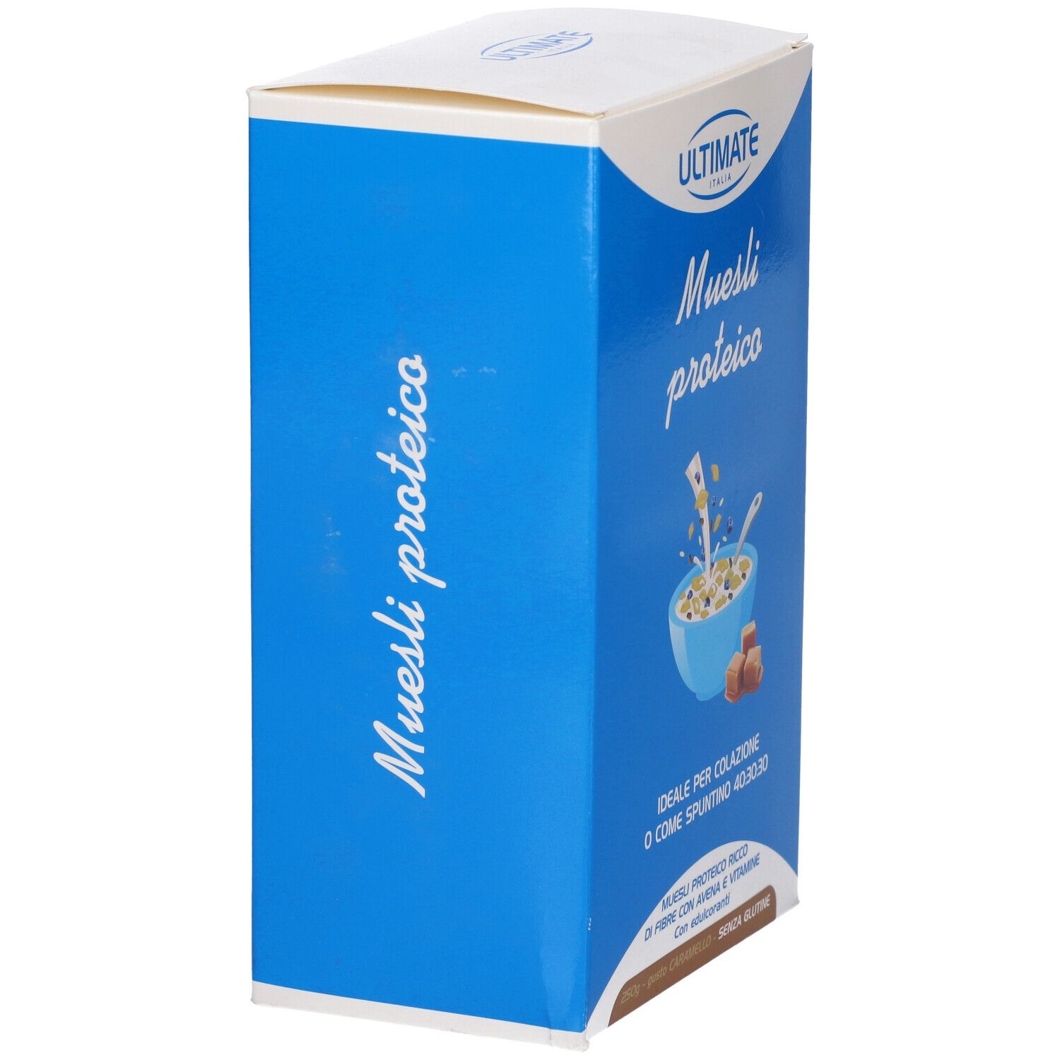 Scatola blu con logo "ULTIMATE" e testo "Muesli proteico". Vista laterale con informazioni sul prodotto.