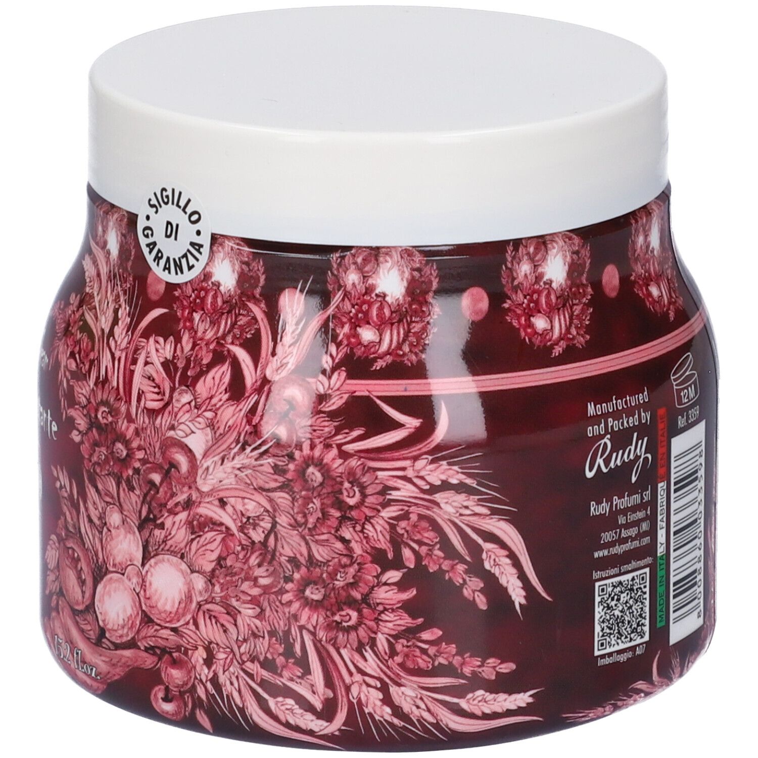 Vista laterale di un barattolo di vetro di crema corpo. Etichetta rossa con illustrazioni floreali e informazioni di produzione.