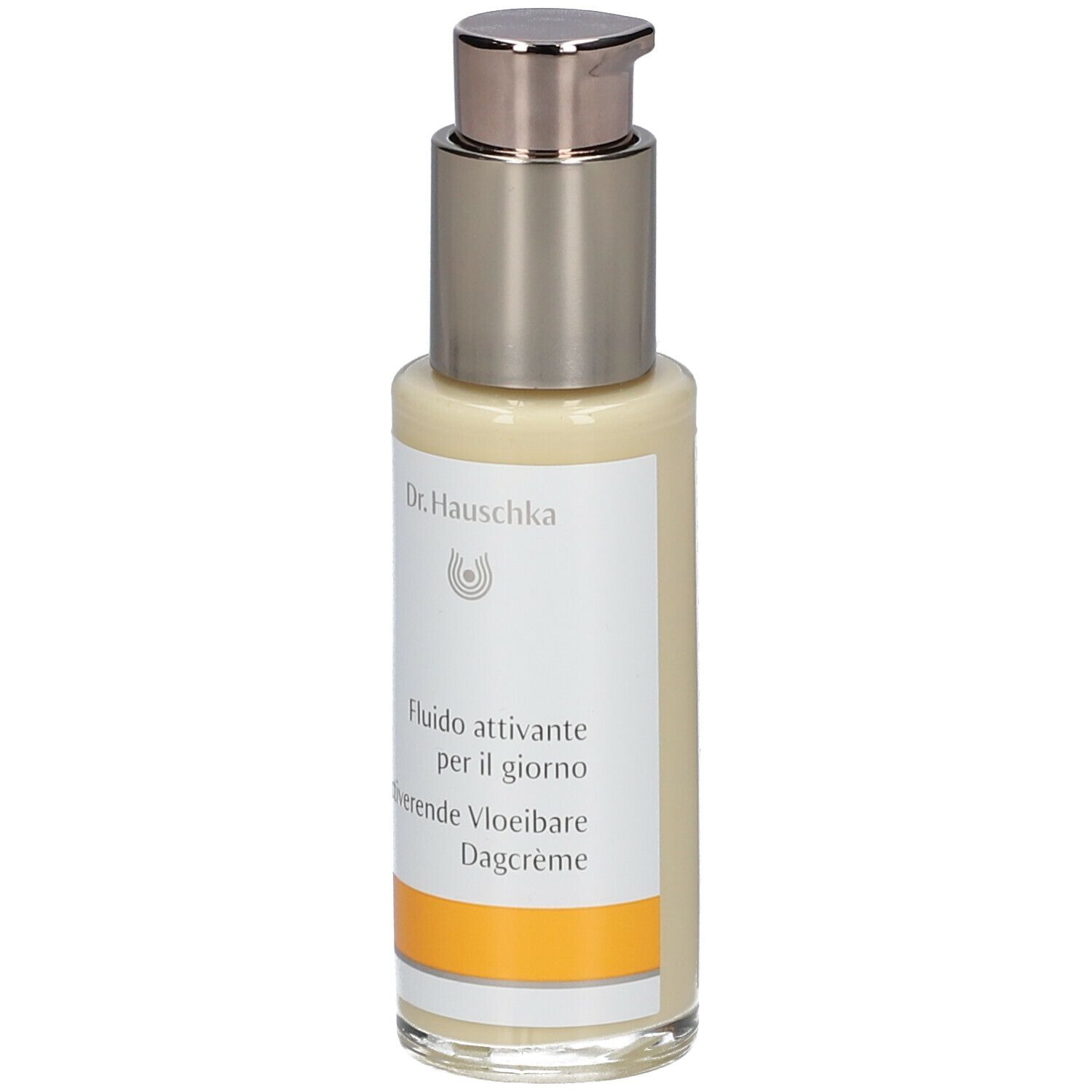 Flacone beige con erogatore argentato. Scritta: Dr. Hauschka, Fluido attivante per il giorno, Activerende Vloeibare Dagcrème.
