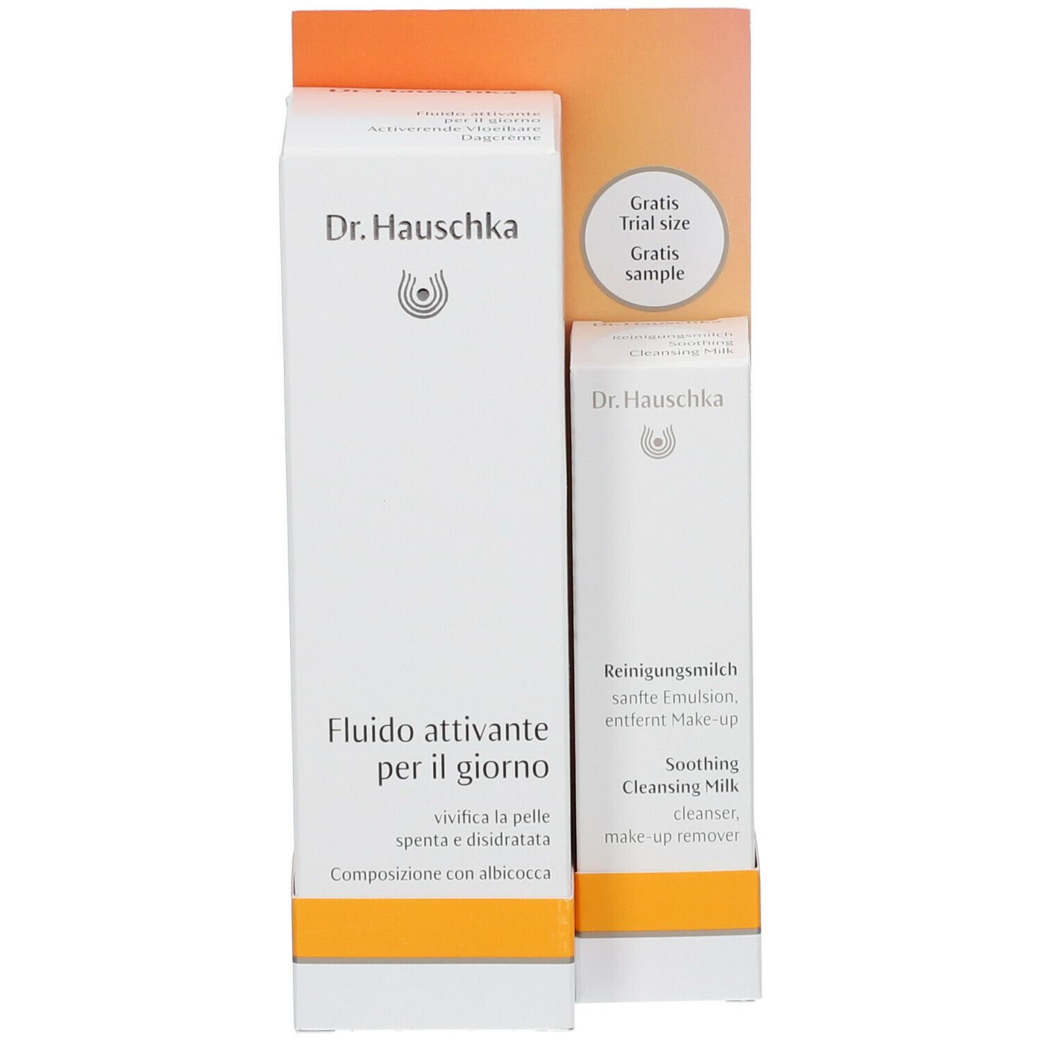 Set di prodotti con confezioni. Scritta: Dr. Hauschka, Fluido attivante per il giorno, Soothing Cleansing Milk.