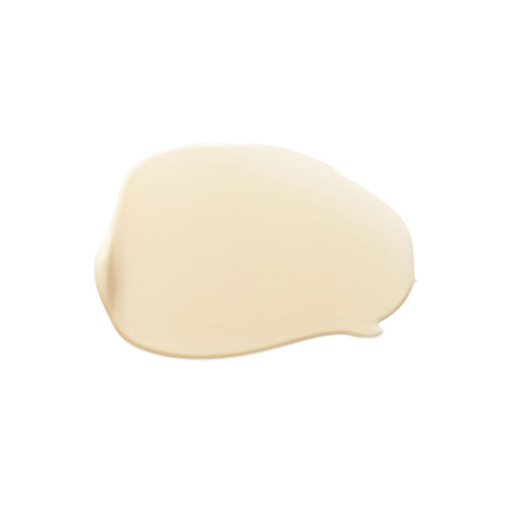 Macchia di crema beige su sfondo bianco.