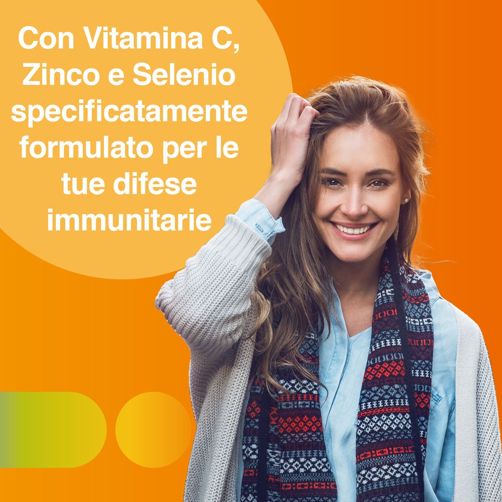 Donna con sciarpa. Testo: Con Vitamina C, Zinco e Selenio specificatamente formulato per le tue difese immunitarie.
