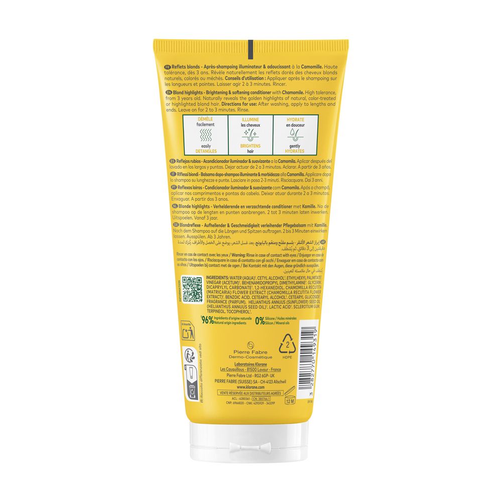 Retro di un tubo giallo. Testo multilingue. Ingredienti, simbolo di riciclaggio, informazioni del produttore.