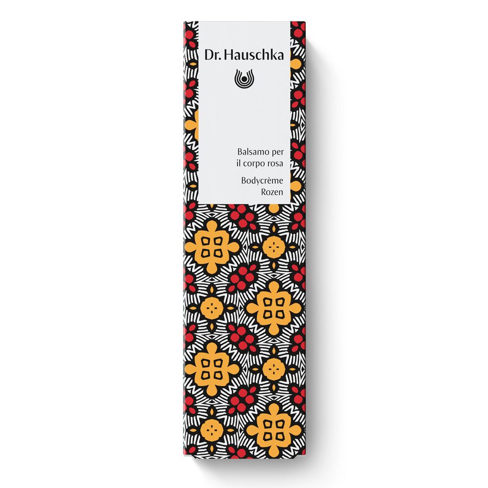 Scatola con motivo floreale. Scritte: Dr. Hauschka, Balsamo per il corpo rosa, Bodycrème Rozen.