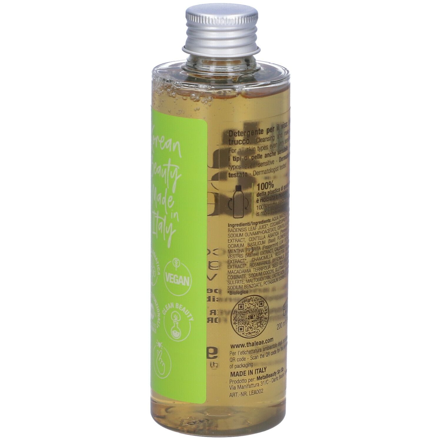 Flacone con etichetta verde. Nome prodotto e logo. Sigillo vegano. Liquido trasparente visibile.