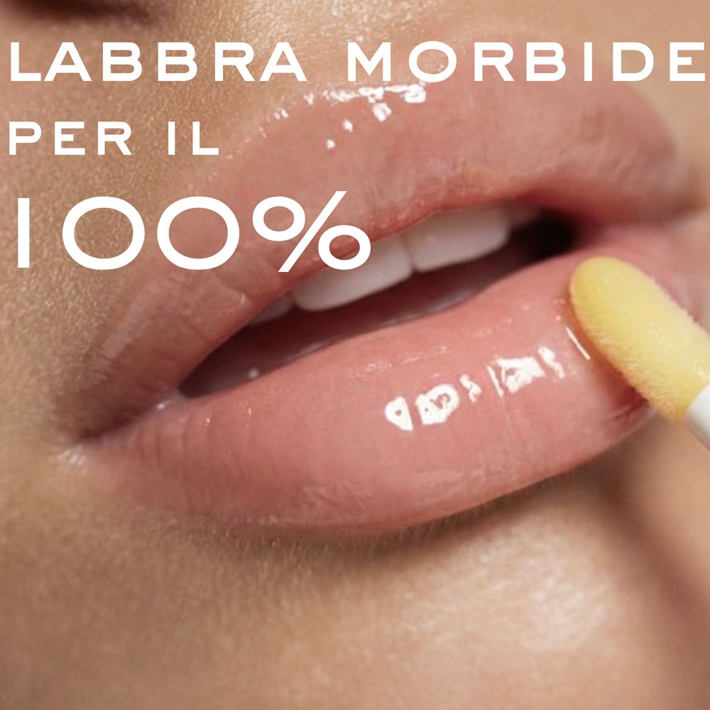 Labbra morbide, 100%. Applicazione di balsamo sulle labbra con applicatore.