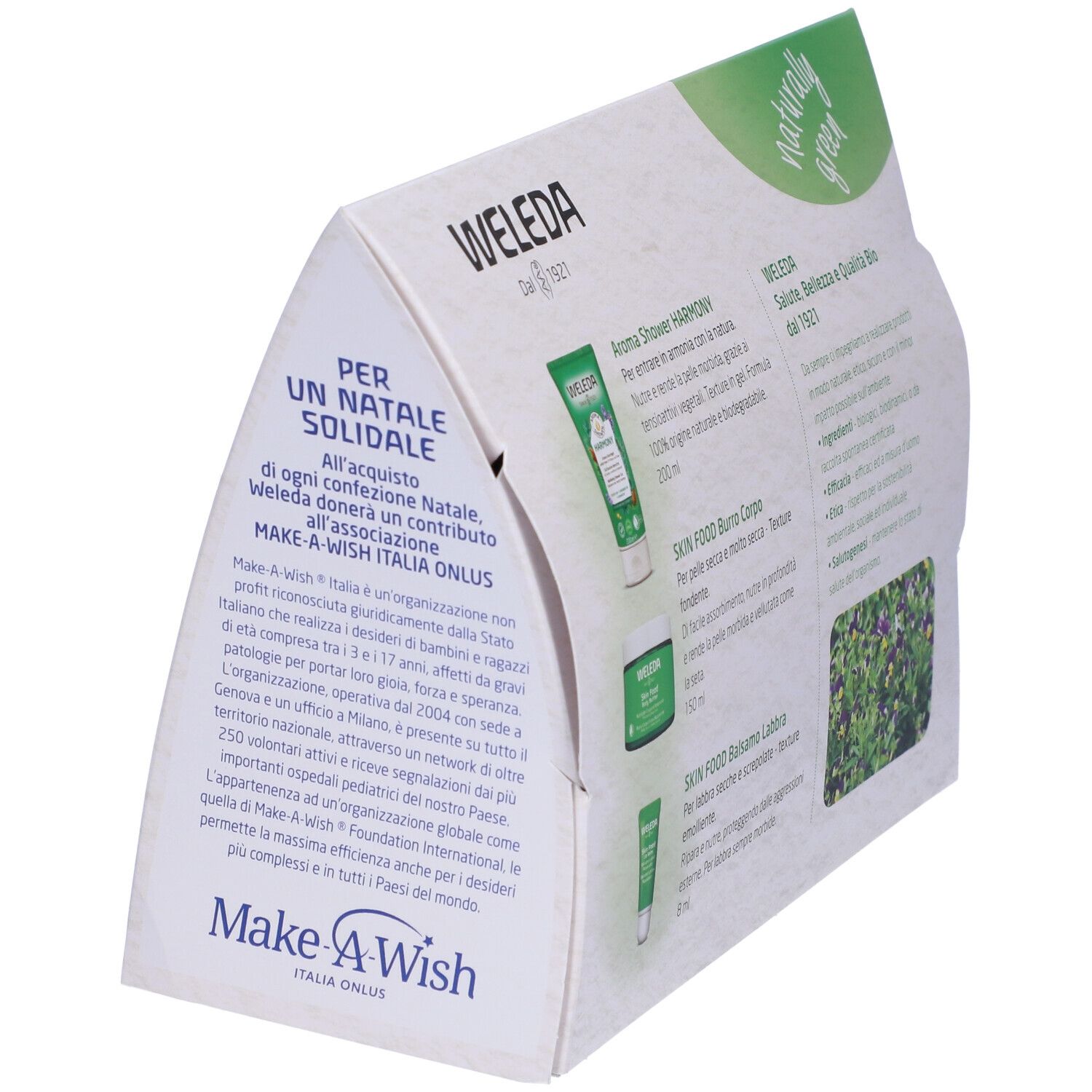 Retro angolato della confezione regalo Weleda. Contiene descrizioni dei prodotti e informazioni. Con logo Make-A-Wish.