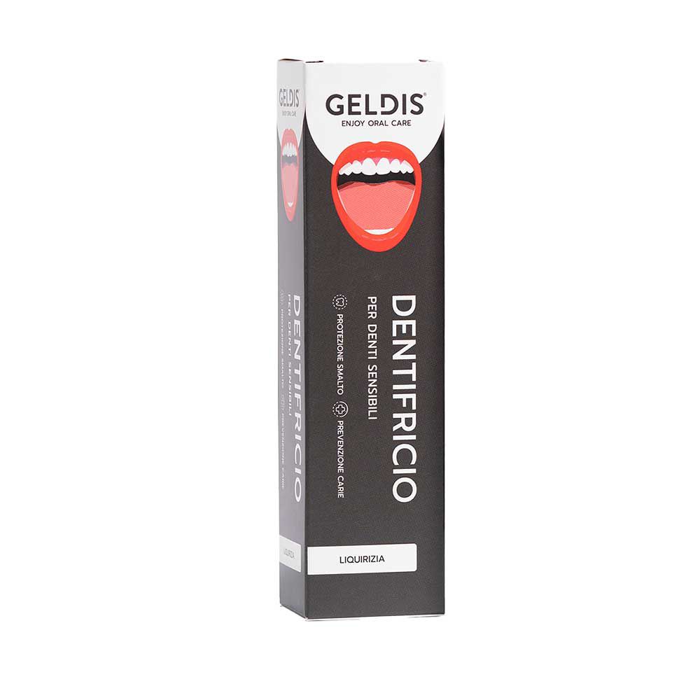 Scatola di dentifricio. Sfondo nero, logo bocca rossa. Testo: Dentifricio, per denti sensibili.