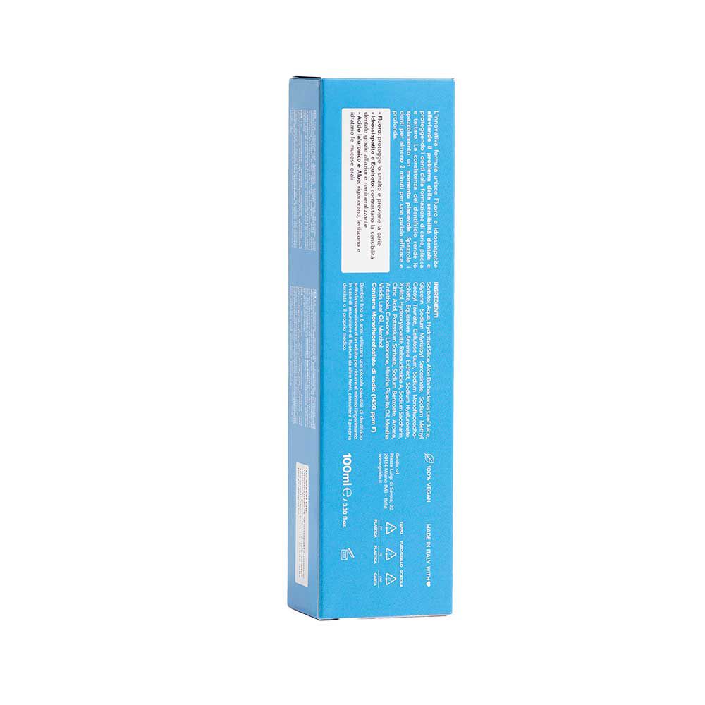 Retro della scatola del dentifricio. Testo multilingue, ingredienti, logo e informazioni.