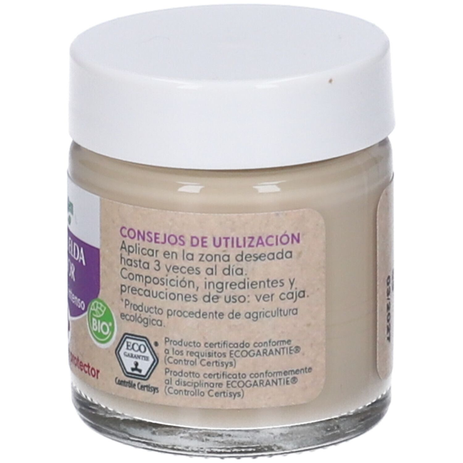 Vasetto di crema con coperchio bianco. Etichetta con nome prodotto, logo e marchio bio. Contenitore in vetro con contenuto beige.