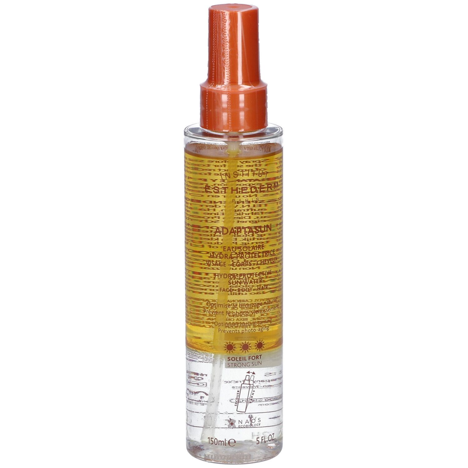 Flacone spray di crema solare. Contenitore trasparente con erogatore arancione. Scritta: Adaptasun Eau Solaire Hydra-protectrice.