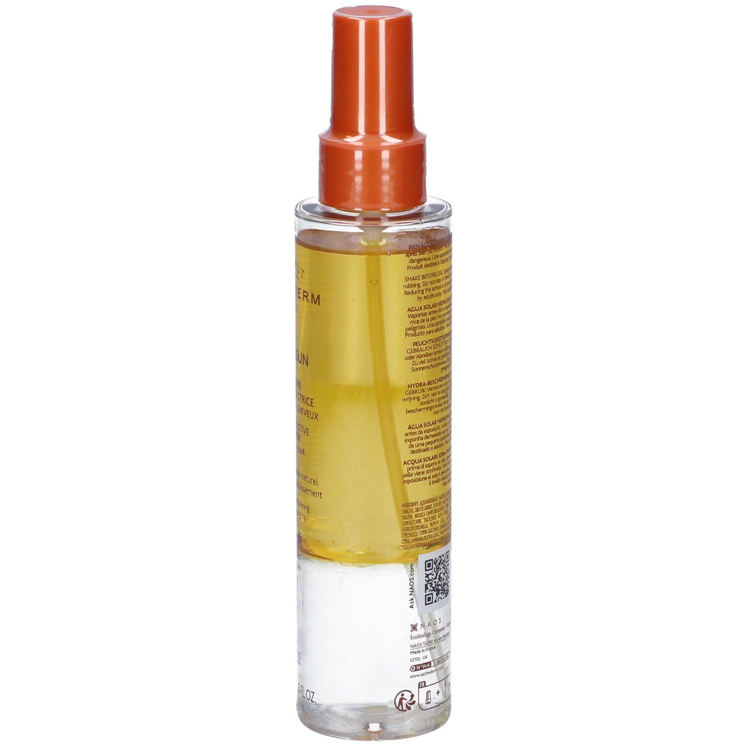 Flacone spray di crema solare. Contenitore trasparente con erogatore arancione. Etichetta con testo e codice QR.