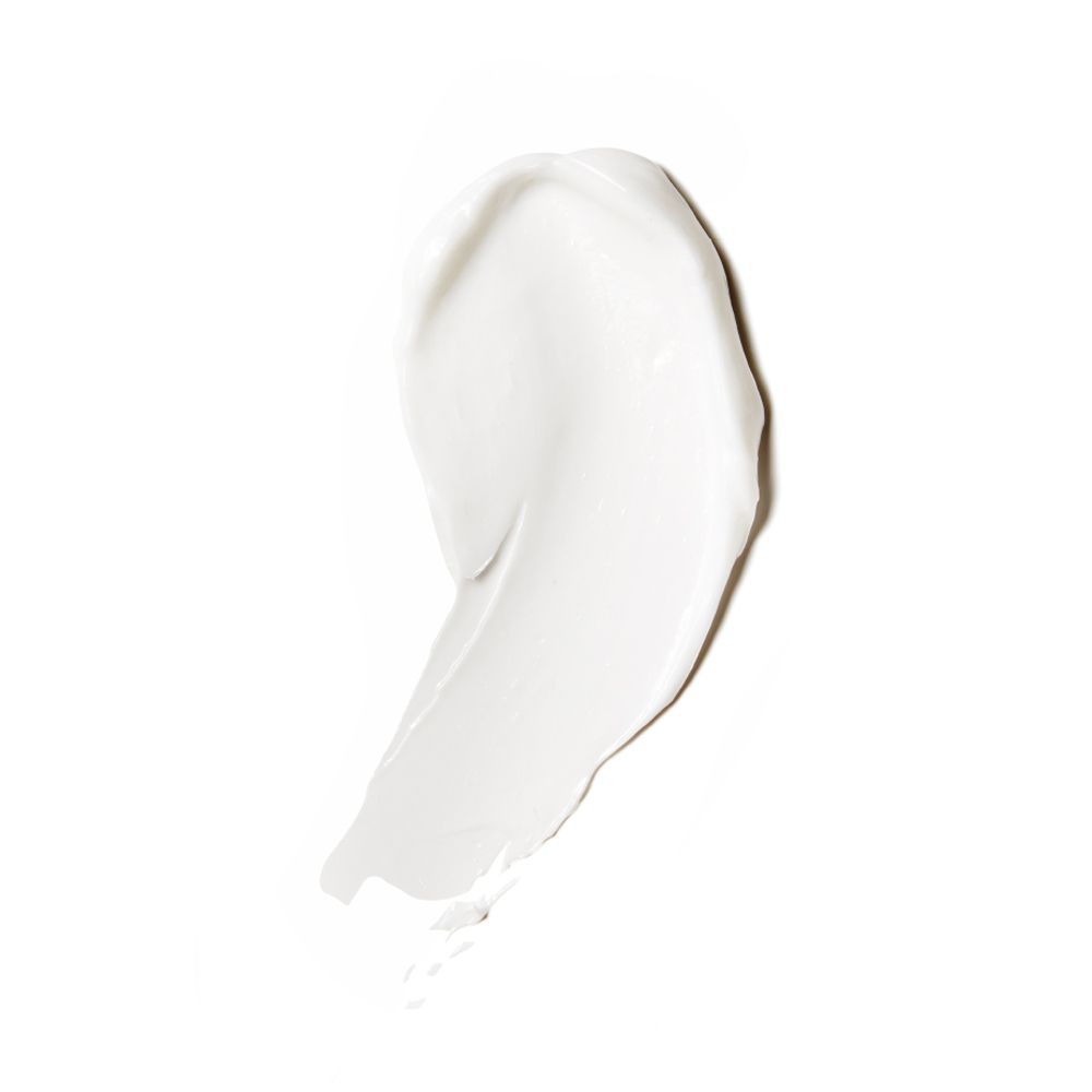 Macchia di crema bianca su sfondo bianco. Texture liscia.