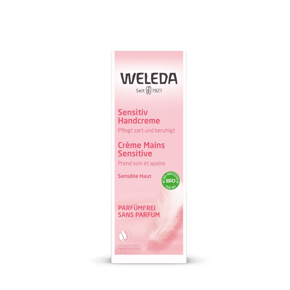 Confezione crema mani WELEDA Sensitive. Scatola rosa con testo: Sensitiv Handcreme, Crème Mains Sensitive, senza profumo. Sigillo bio.
