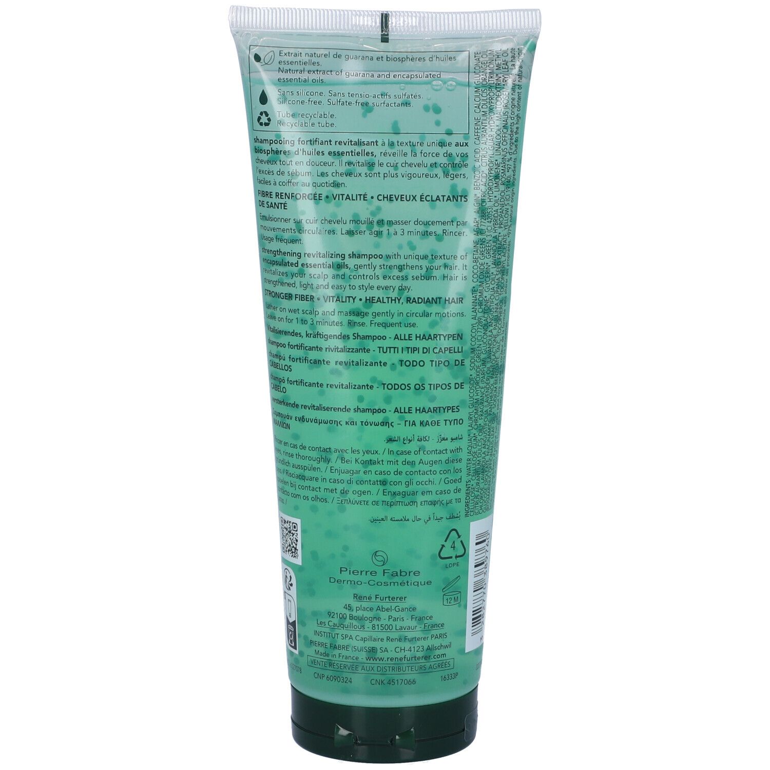 Retro di un tubo di shampoo verde. Testo multilingue. Informazioni sugli ingredienti e sul produttore.