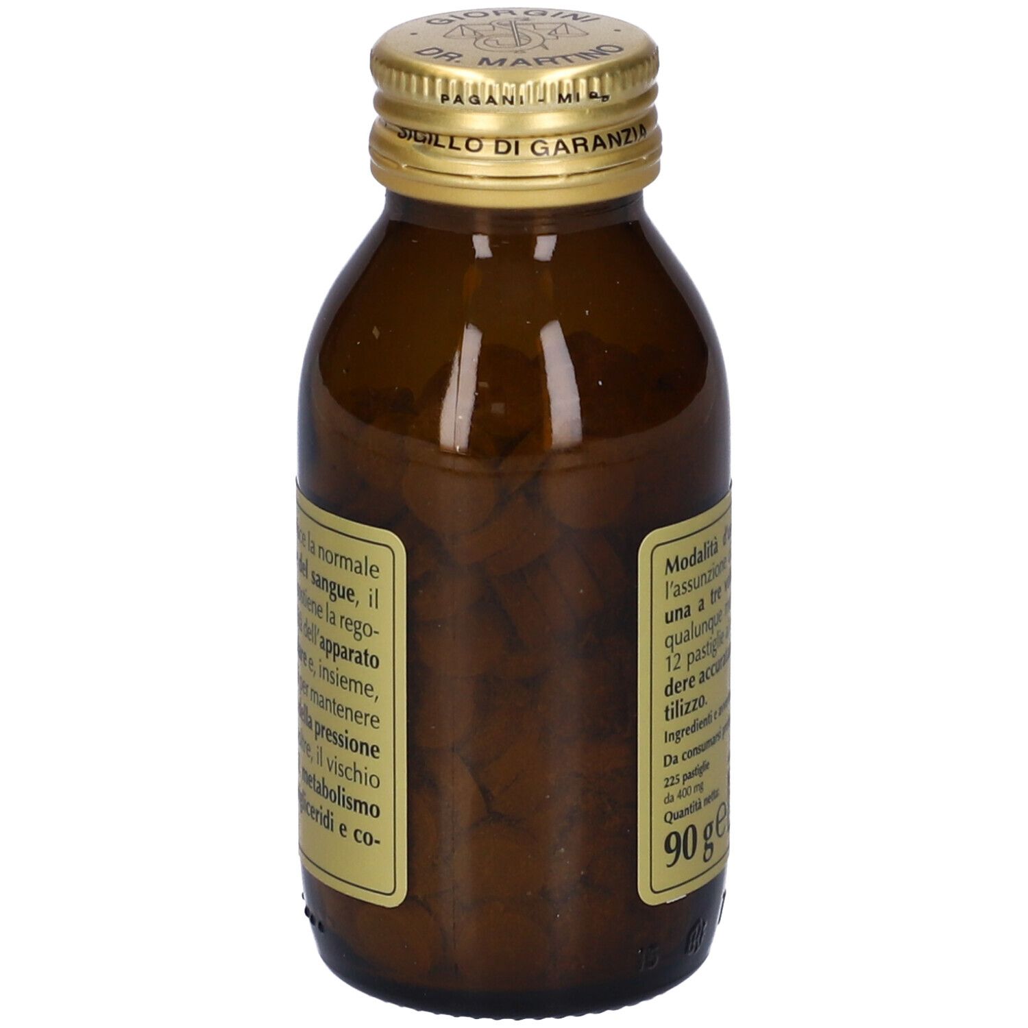 Bottiglia di vetro marrone con tappo dorato, piena di compresse. Etichetta con informazioni sul prodotto.