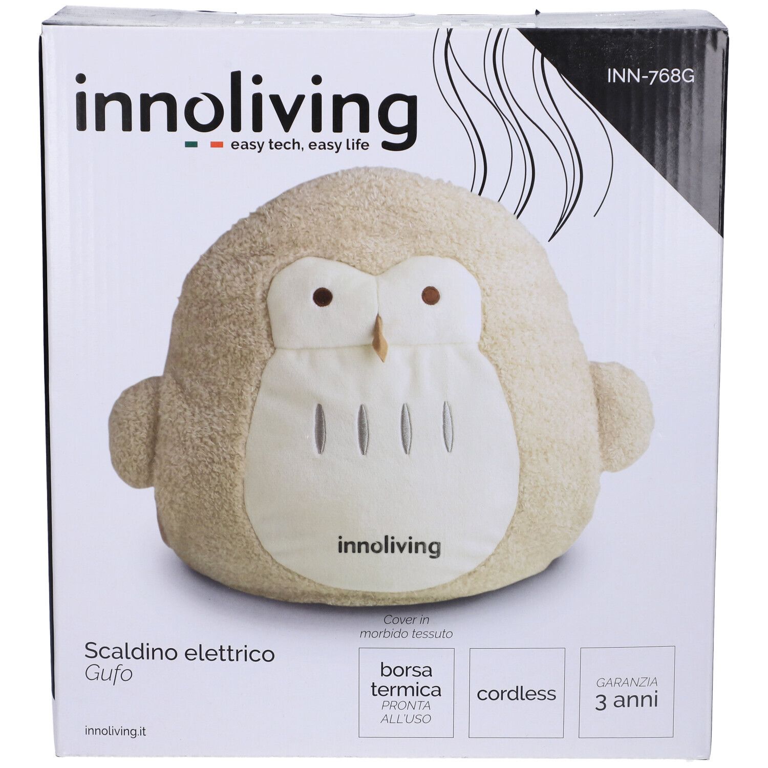 Cuscino termico a forma di gufo beige nella confezione. Marchio: Innoliving. Testo: Scaldino elettrico Gufo, Borsa termica, cordless, 3 anni garanzia.
