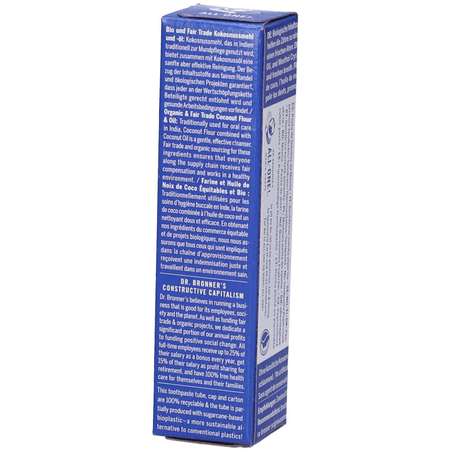 Scatola blu con testo. Scritto: DR. BRONNER'S, olio di cocco Fair Trade. Testo sugli ingredienti e la sostenibilità.