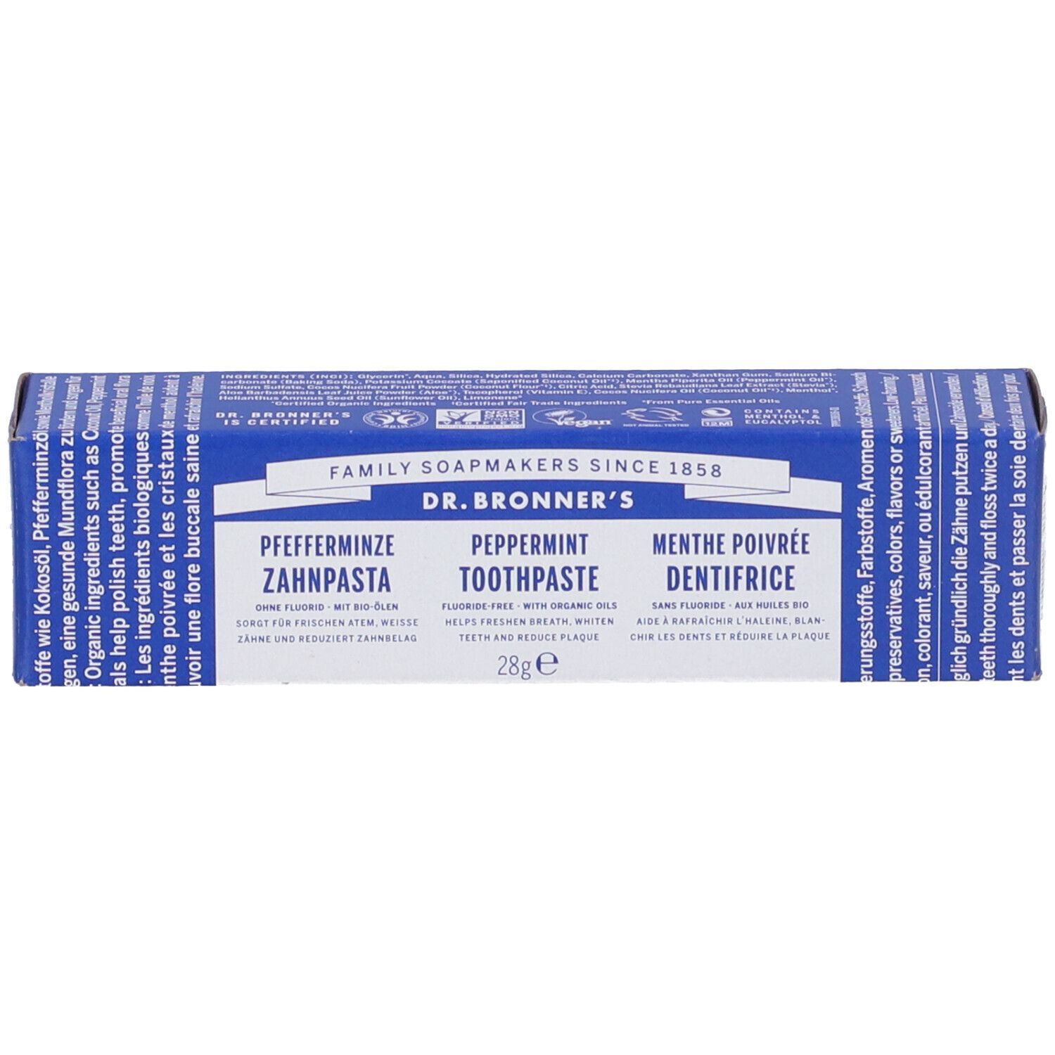 Scatola blu e bianca di dentifricio DR. BRONNER'S. Scritto: Pfefferminz, Peppermint, Menthe poivrée. 28g.
