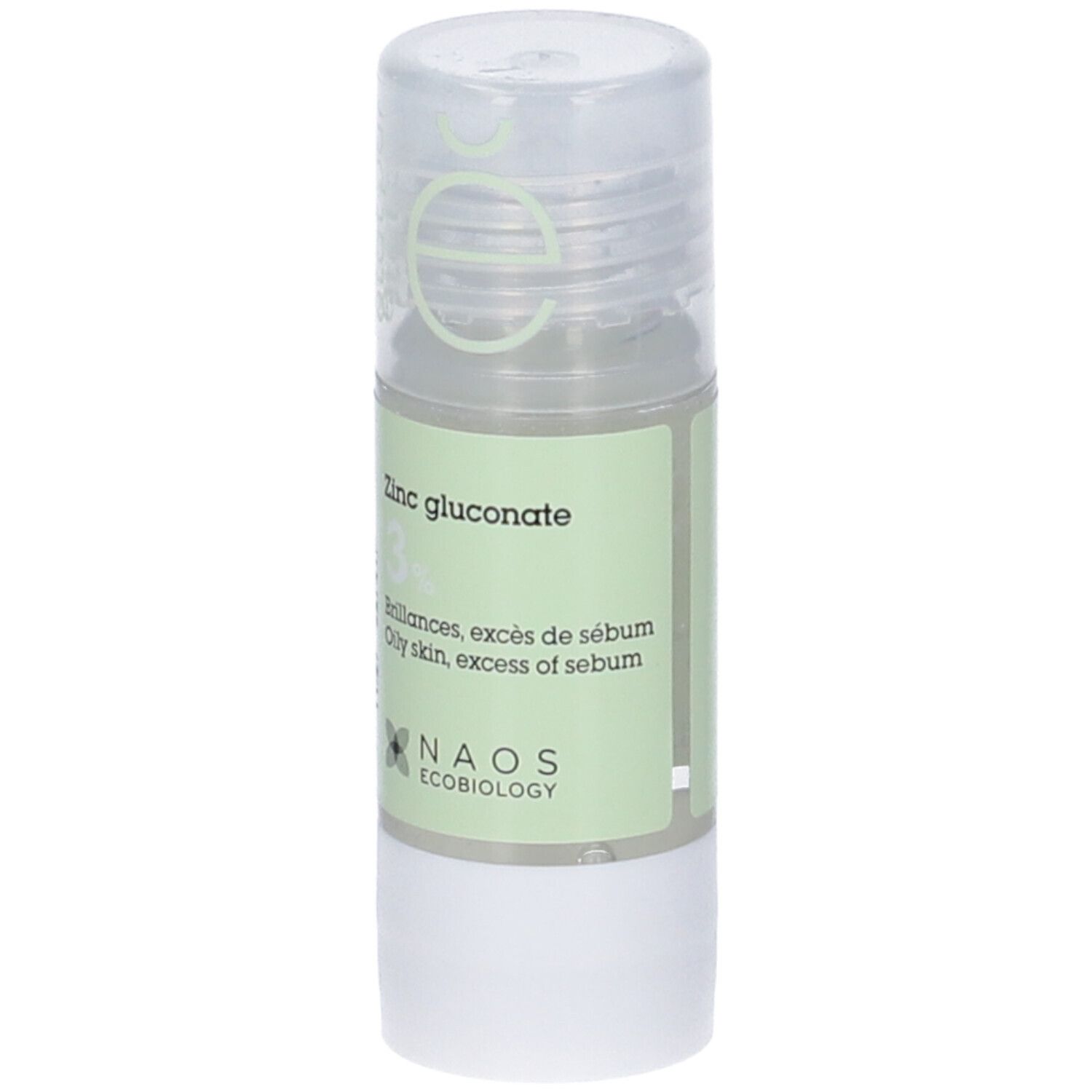 Flacone cilindrico con etichetta verde. Scritta: Zinc gluconate 3%. Logo NAOS Ecobiology. Tappo trasparente.