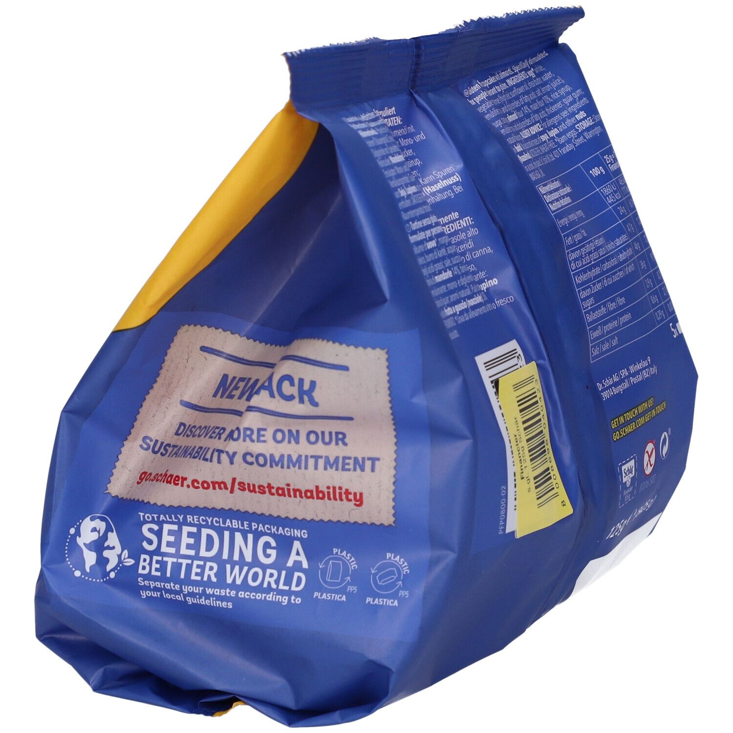 Retro della confezione di Financier-Almond cake senza glutine Schär. Con logo riciclo e informazioni sulla sostenibilità.