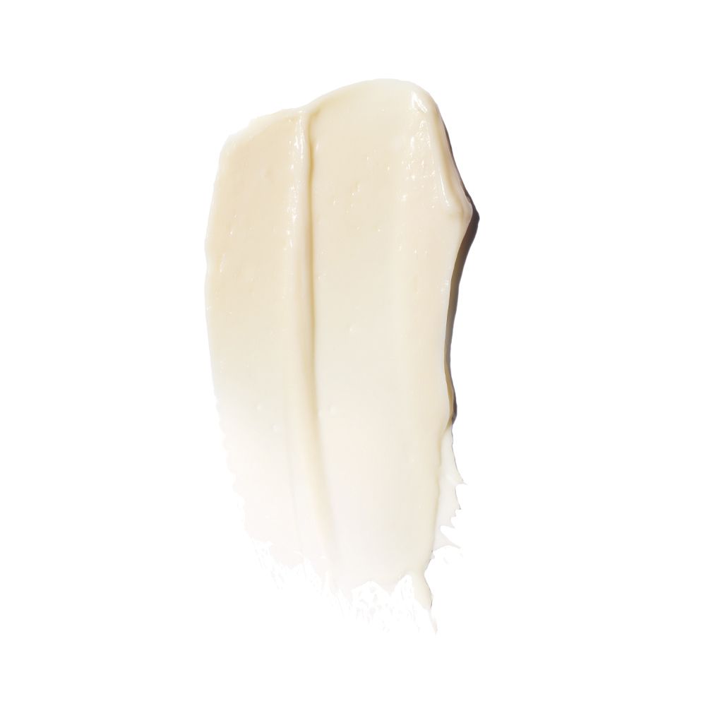 Macchia di crema per la cura della pelle color crema chiaro su sfondo bianco. Testura visibile.