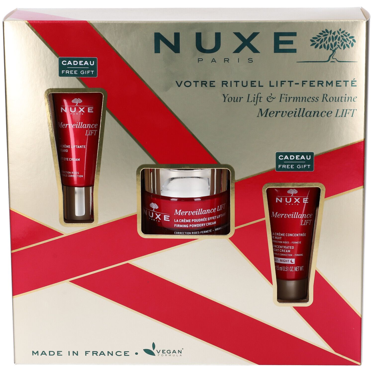 Confezione regalo con tre prodotti. Logo Nuxe, testo, nastro rosso. Logo vegano.