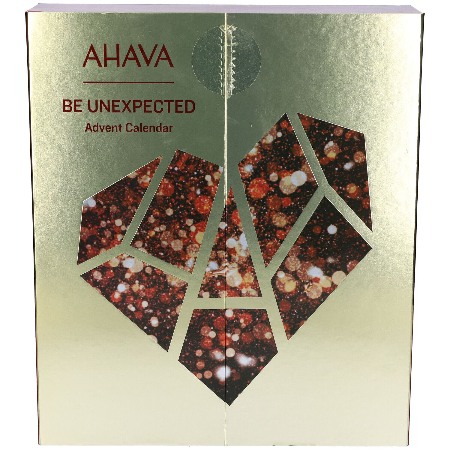 Calendario dell'Avvento dorato. Scritta: AHAVA, BE UNEXPECTED. Design a cuore geometrico con finestra.