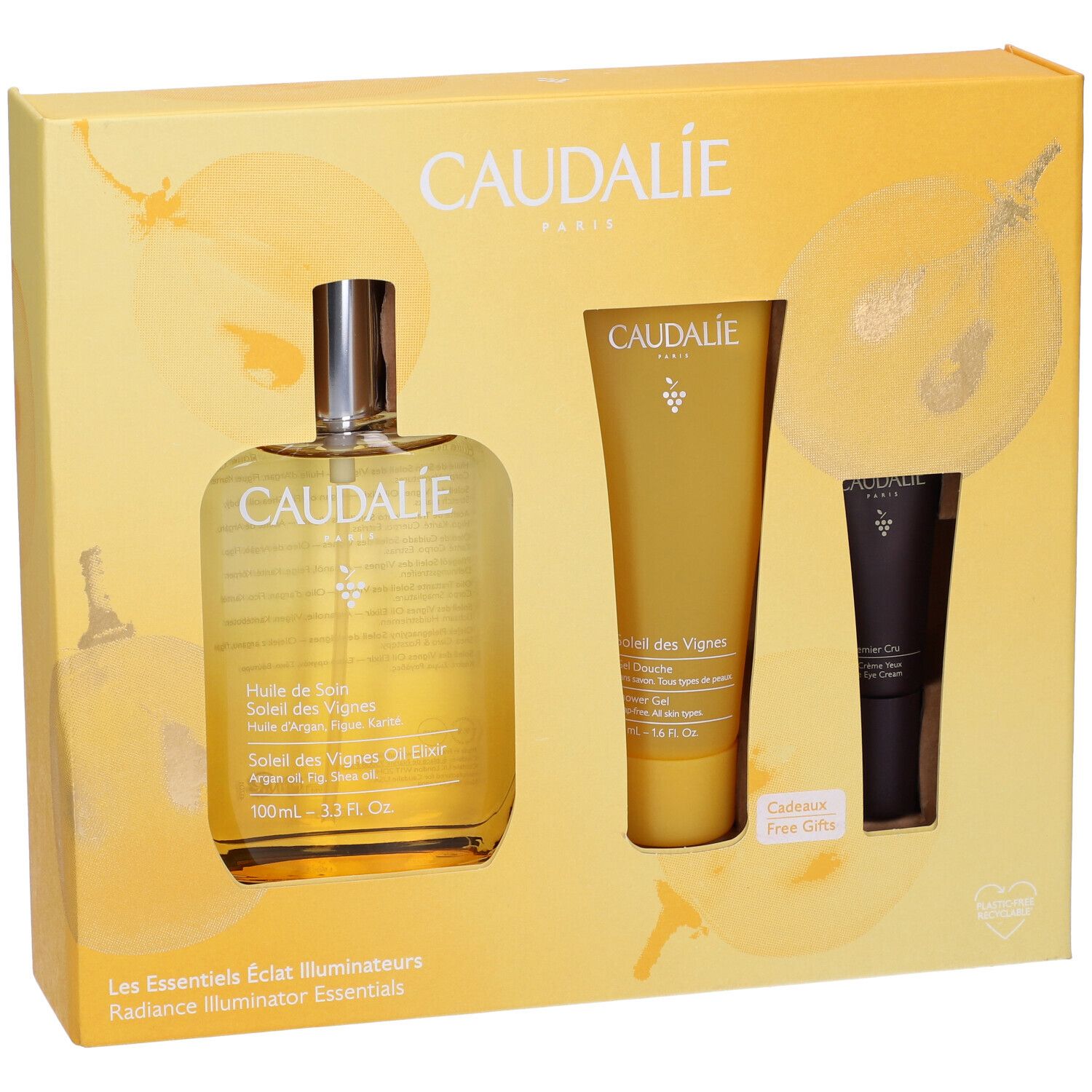 Confezione regalo con tre prodotti. Bottiglia, tubo e tubo crema occhi. Logo Caudalie e nomi dei prodotti visibili.