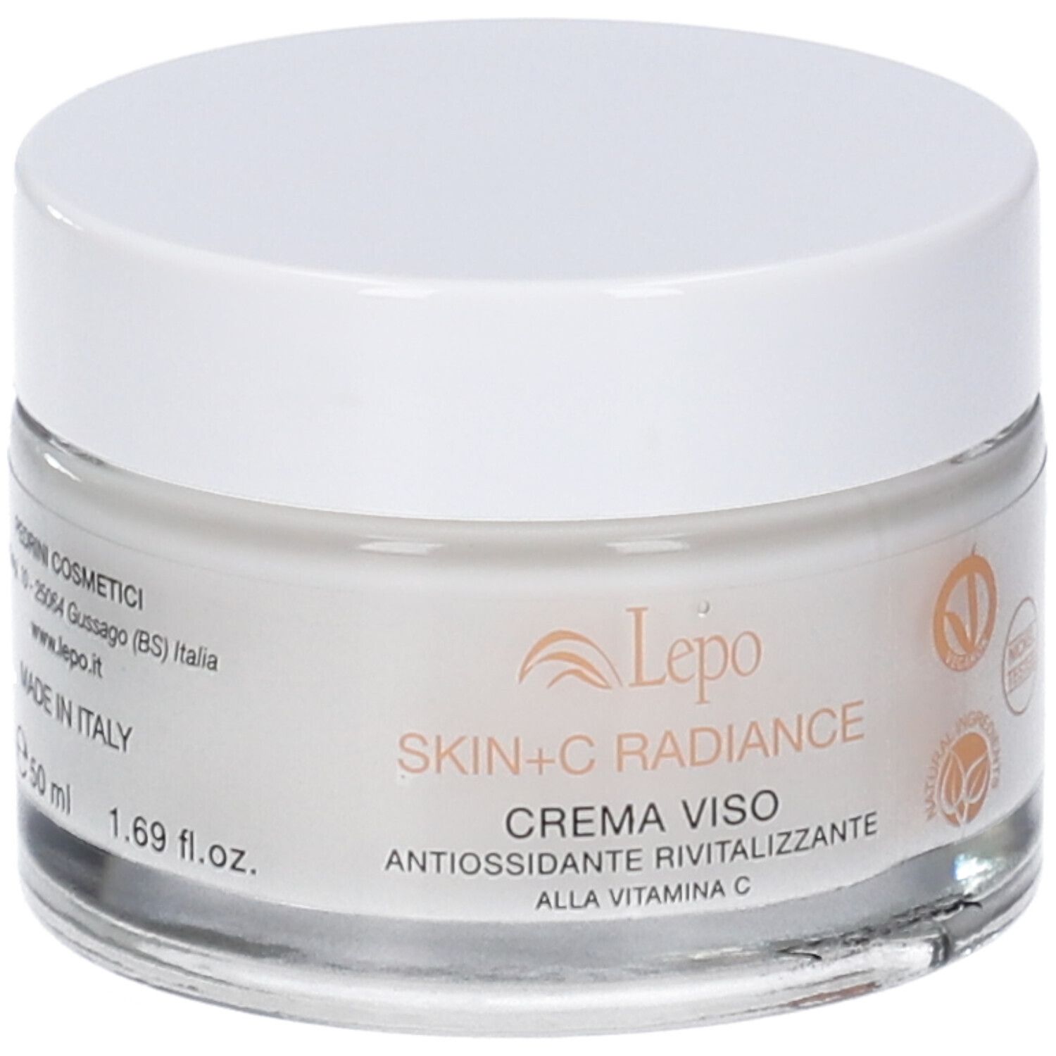 Vaso di crema con coperchio bianco. Scritta: Skin+C Radiance, Crema Viso, antiossidante rivitalizzante. 1.69 fl.oz.