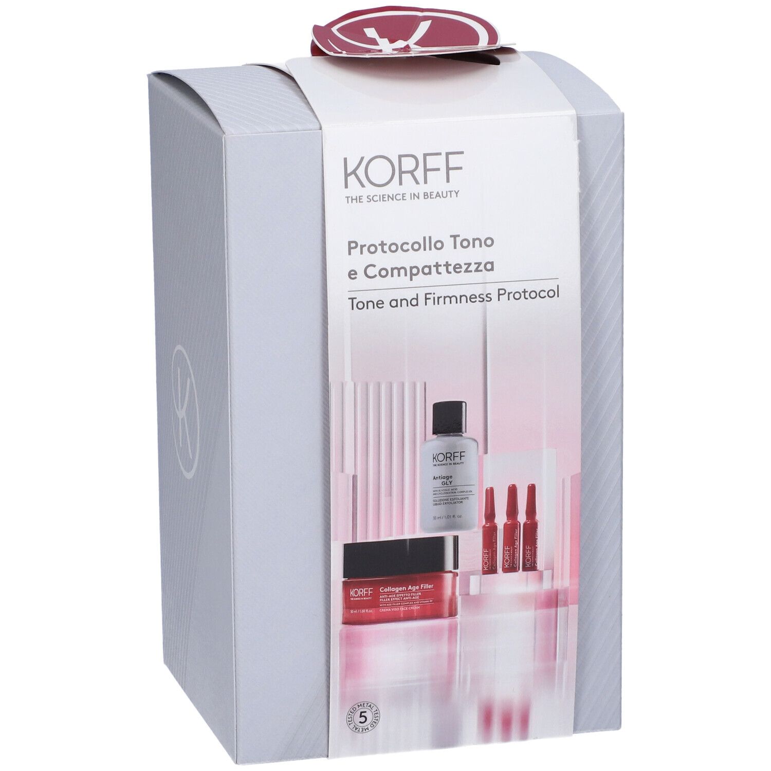 Confezione regalo KORFF. Logo e nomi dei prodotti visibili. Contiene flaconi e fiale. Confezione grigia con dettagli rossi.