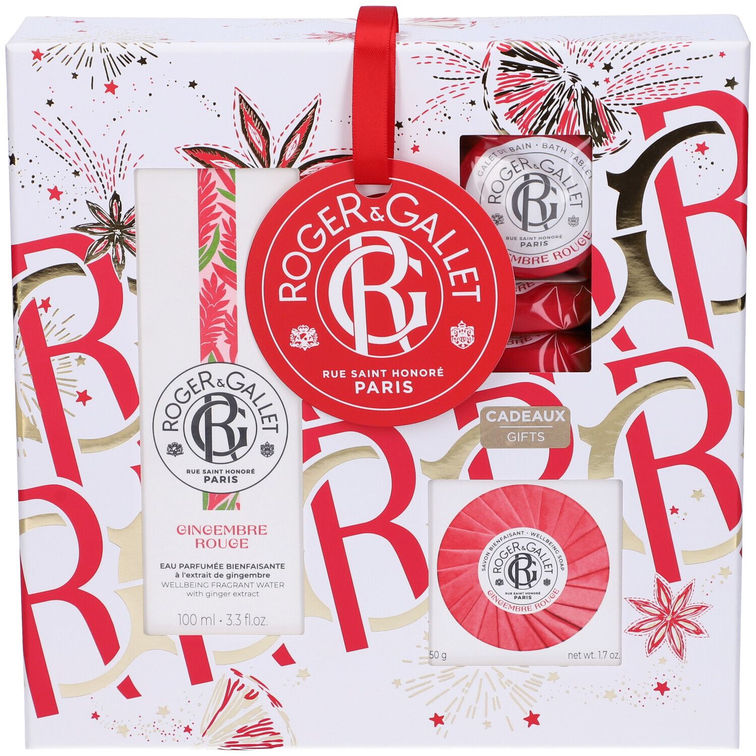 Confezione regalo con prodotti. Etichetta rossa con logo. Contiene flacone, sapone e altri prodotti. Confezione decorata in rosso e oro.