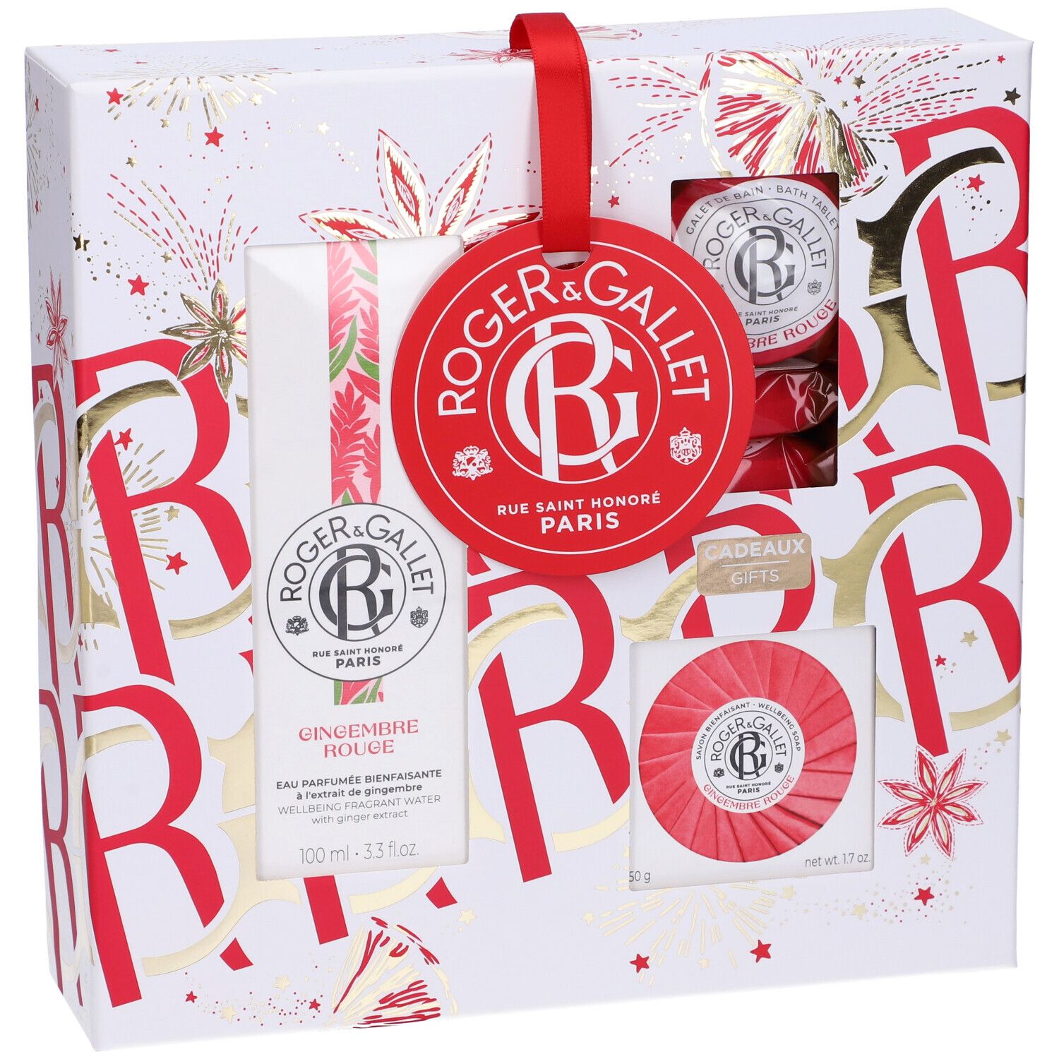 Confezione regalo con prodotti. Etichetta rossa con logo. Contiene flacone, sapone e altri prodotti. Confezione decorata in rosso e oro.