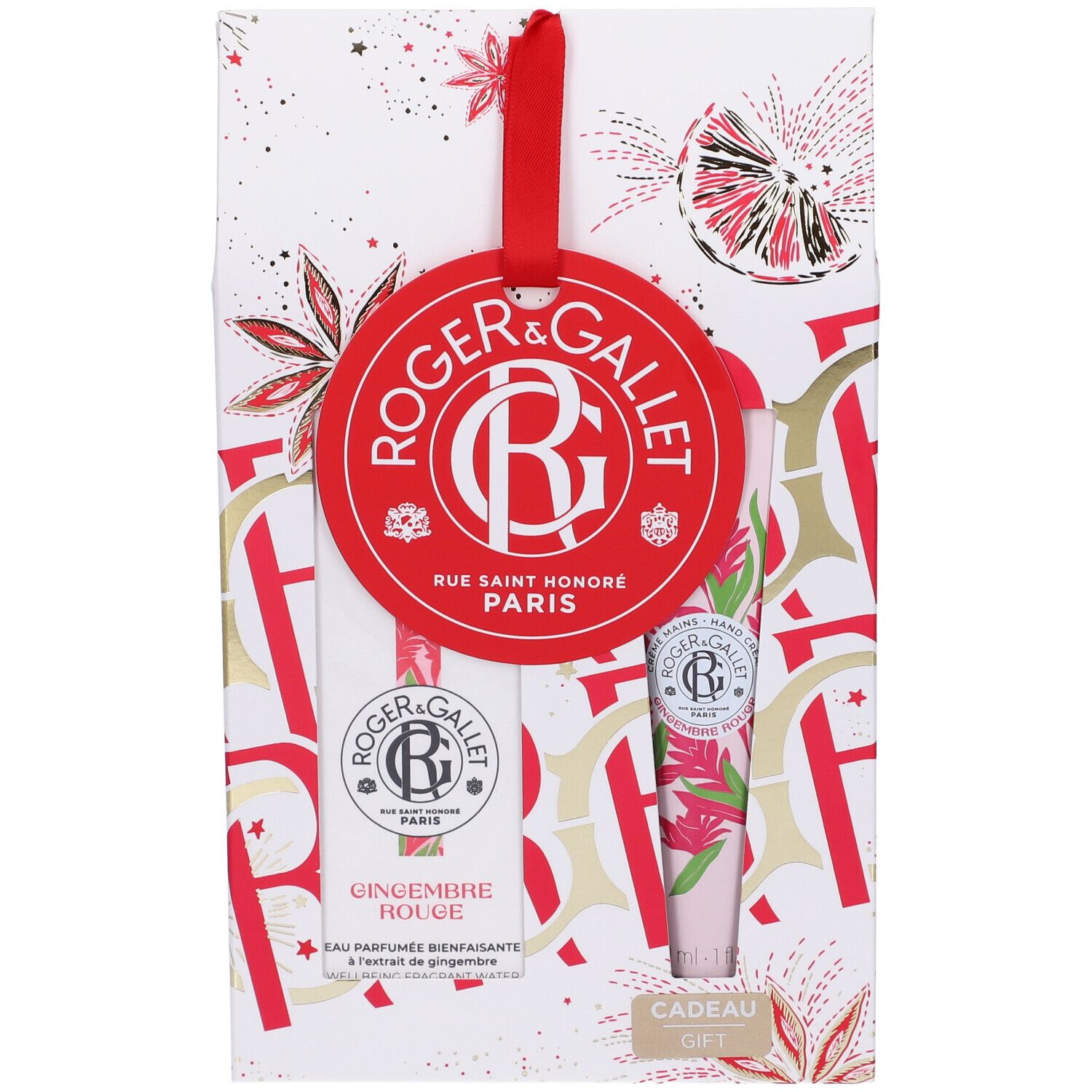 Confezione regalo con nastro rosso. Contiene due prodotti e un'etichetta rossa con logo e testo. Imballaggio con elementi floreali.