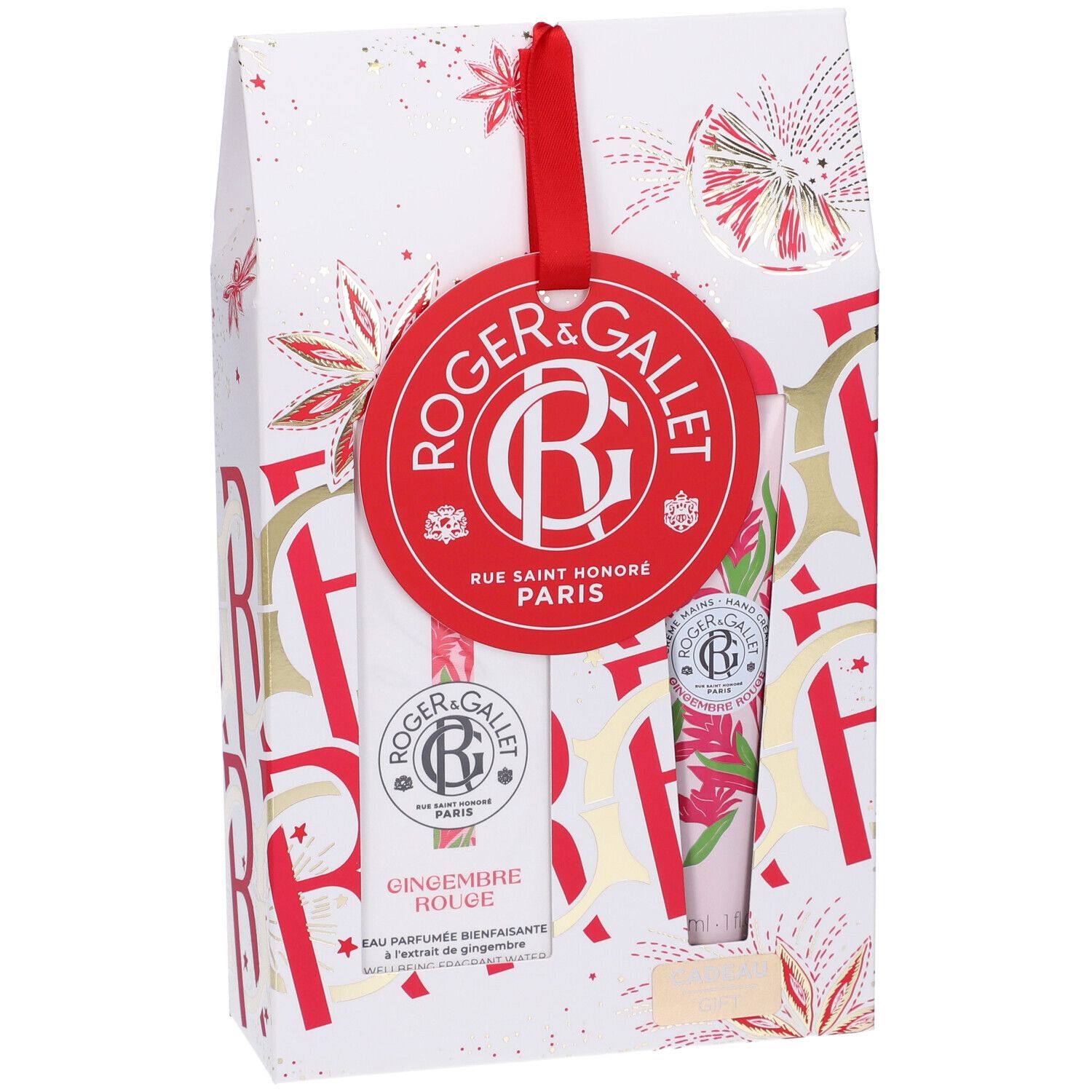 Confezione regalo con nastro rosso. Contiene due prodotti e un'etichetta rossa con logo e testo. Imballaggio con elementi floreali.