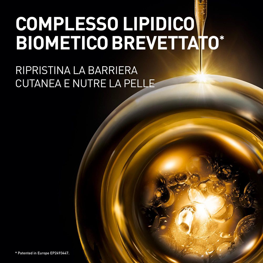 Liquido dorato. Testo: Complesso lipidico biometico brevettato. Ripristina la barriera cutanea e nutre la pelle.