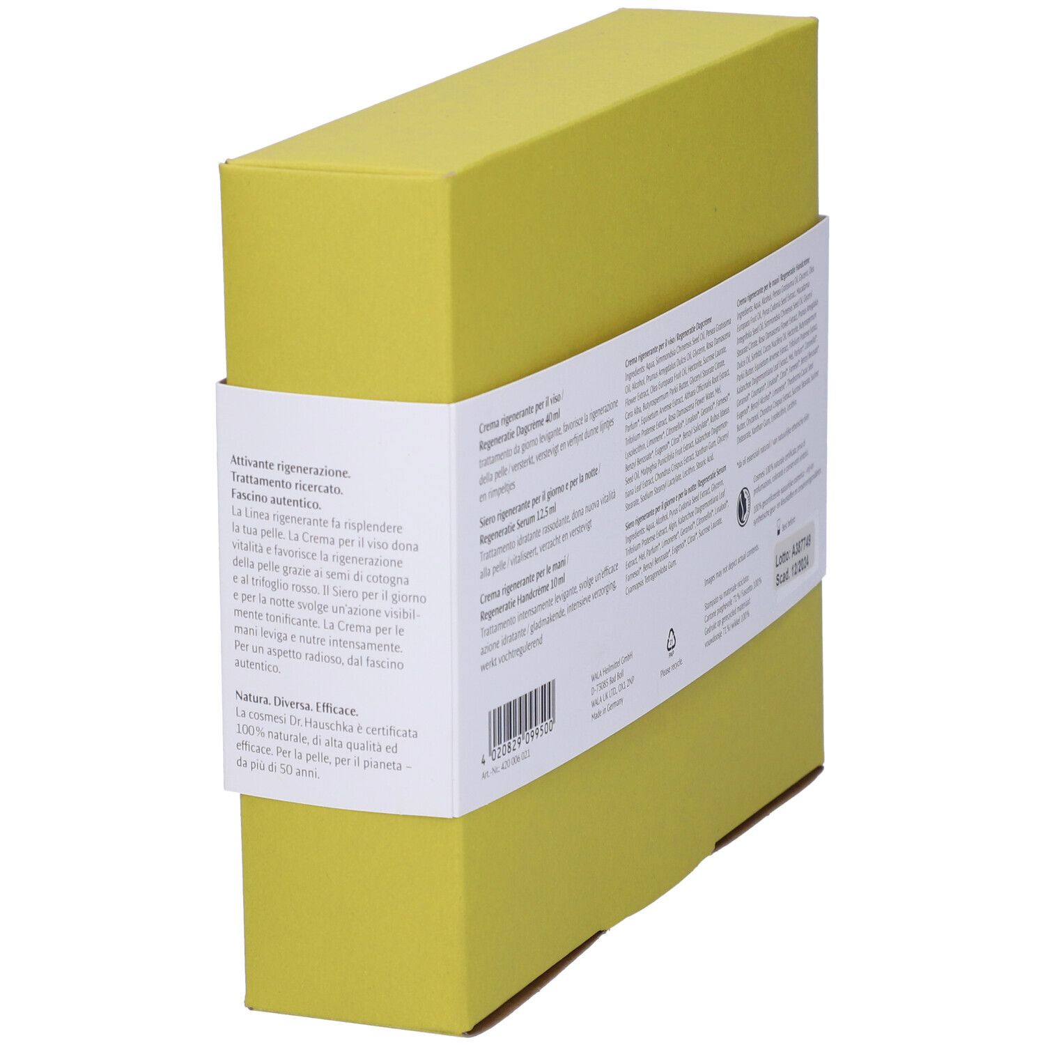 Vista laterale del set regalo. Scatola gialla con informazioni sul prodotto. Testo multilingue.