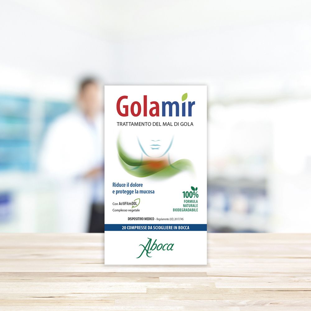 Scatola di compresse Golamir. Scritta: Golamir, trattamento del mal di gola. Logo Aboca.