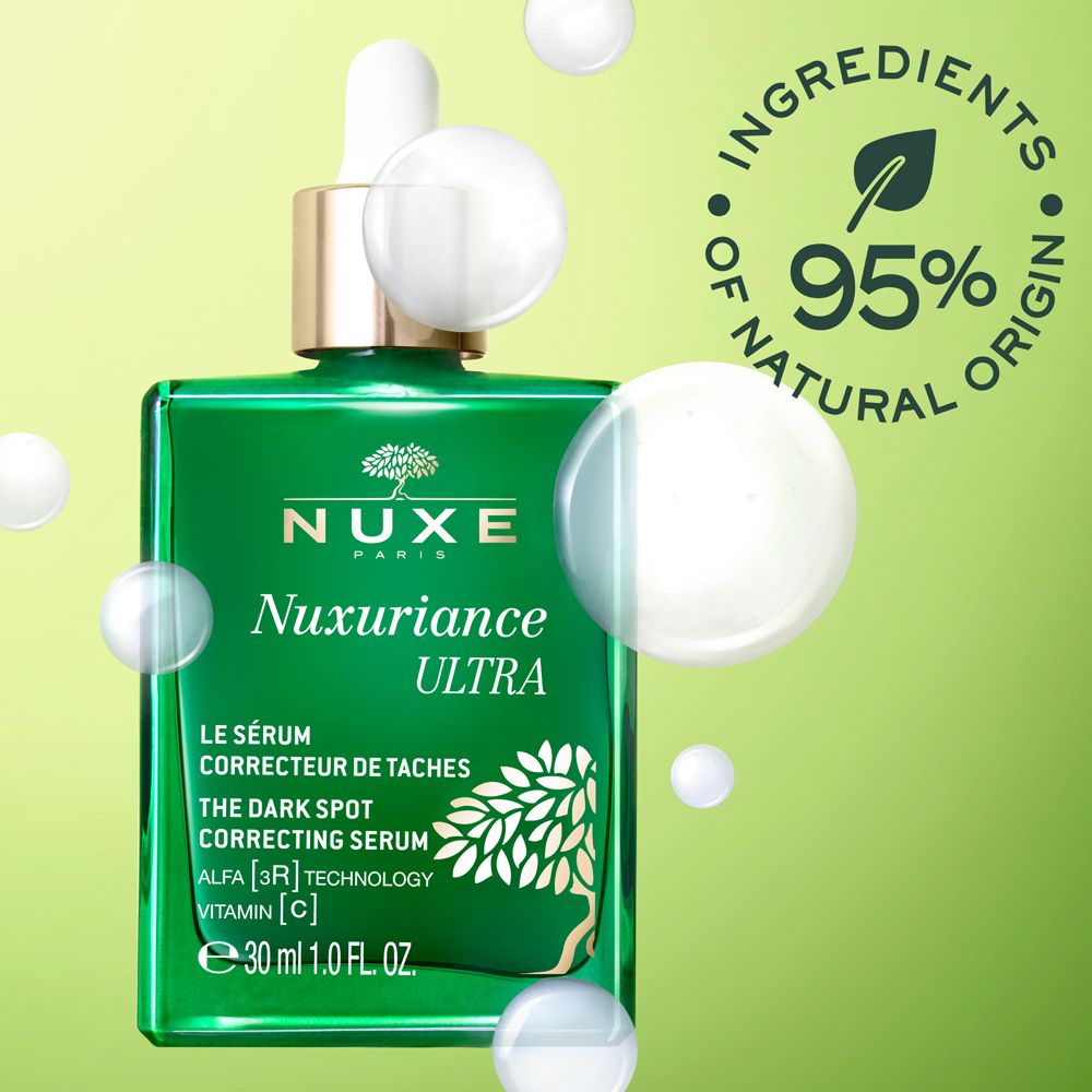 Flacone verde con contagocce e bolle. Scritta: Nuxe, Nuxuriance Ultra, Siero, 95% di origine naturale.