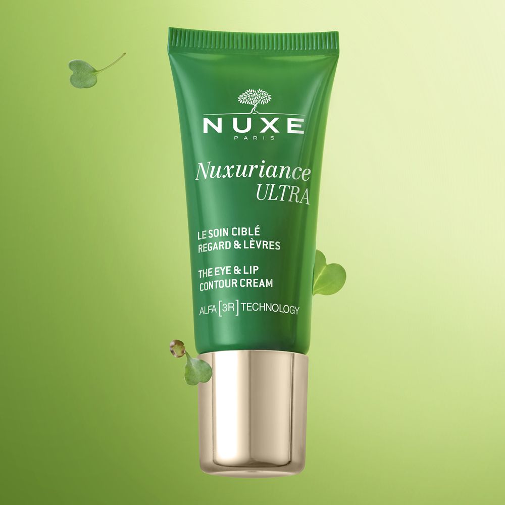 Tubo verde con trifogli sullo sfondo. Scritta: Nuxe, Nuxuriance Ultra, crema contorno occhi e labbra.