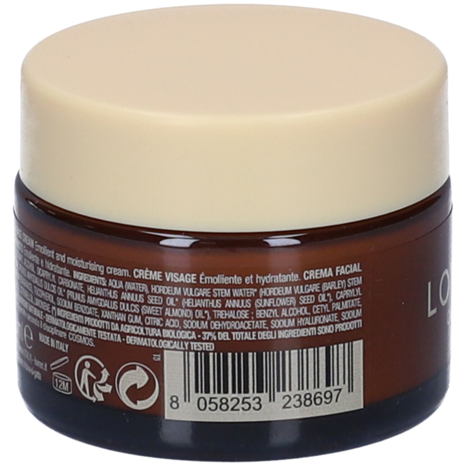 Retro di un vasetto di crema marrone con coperchio beige. Testo: ingredienti, Crema Viso, Crema Emolliente. Codice a barre e logo Cosmos.